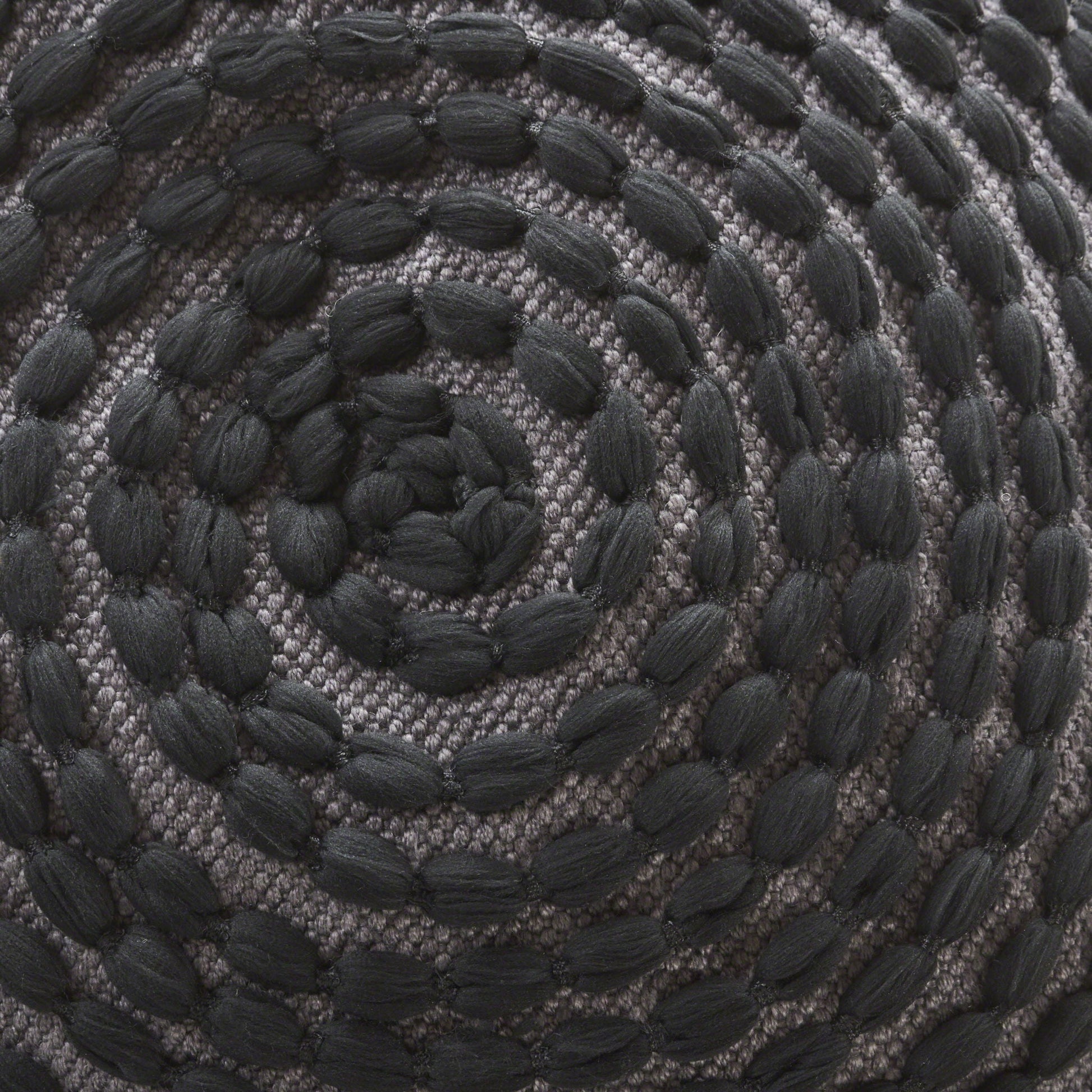 River Handcrafted Cylindrical Pouf with black rope texture on gray weave base on Tampa Home & Garden Store
