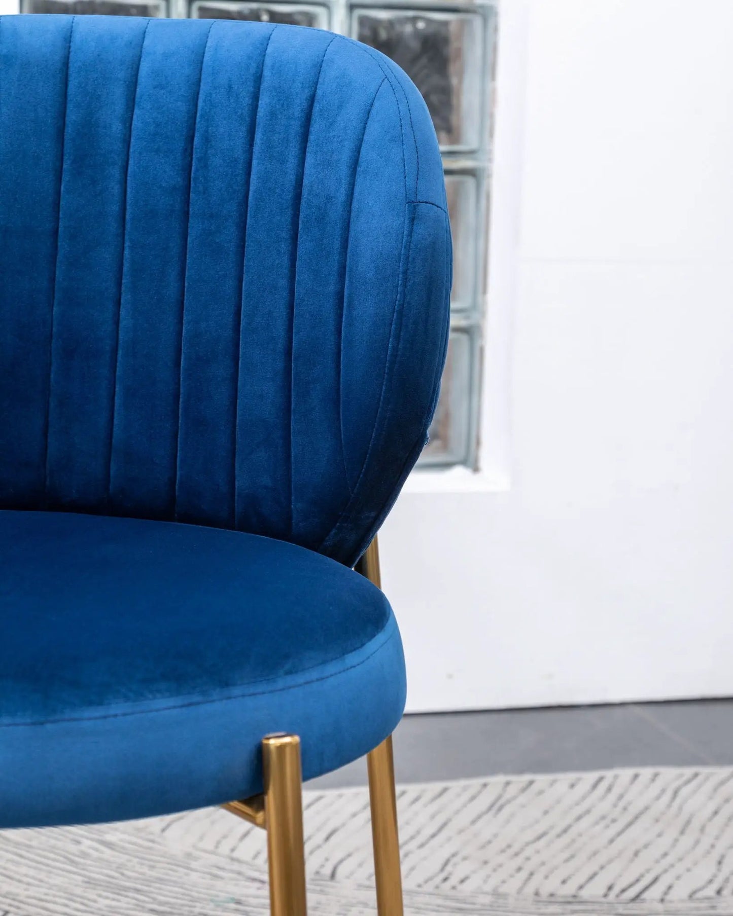 Amoa contemporary blue velvet dining chair with vertical channel tufting and gold metal legs on Tampa Home & Garden Store