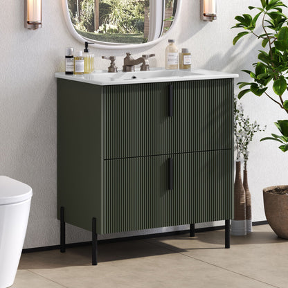 Bathroom vanity with white ceramic sink on dark green fluted cabinet and bronze faucet on Tampa Home & Garden Store