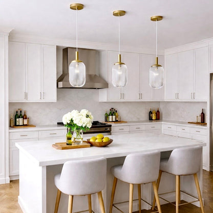 Gemma Pendant Lamp, three ribbed glass pendants with brass accents over white kitchen island on Tampa Home & Garden Store