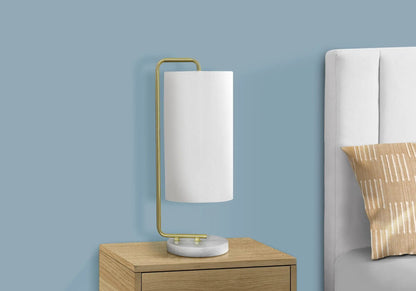 Table lamp with white cylindrical shade, brass curved frame, marble base on nightstand on Tampa Home & Garden Store