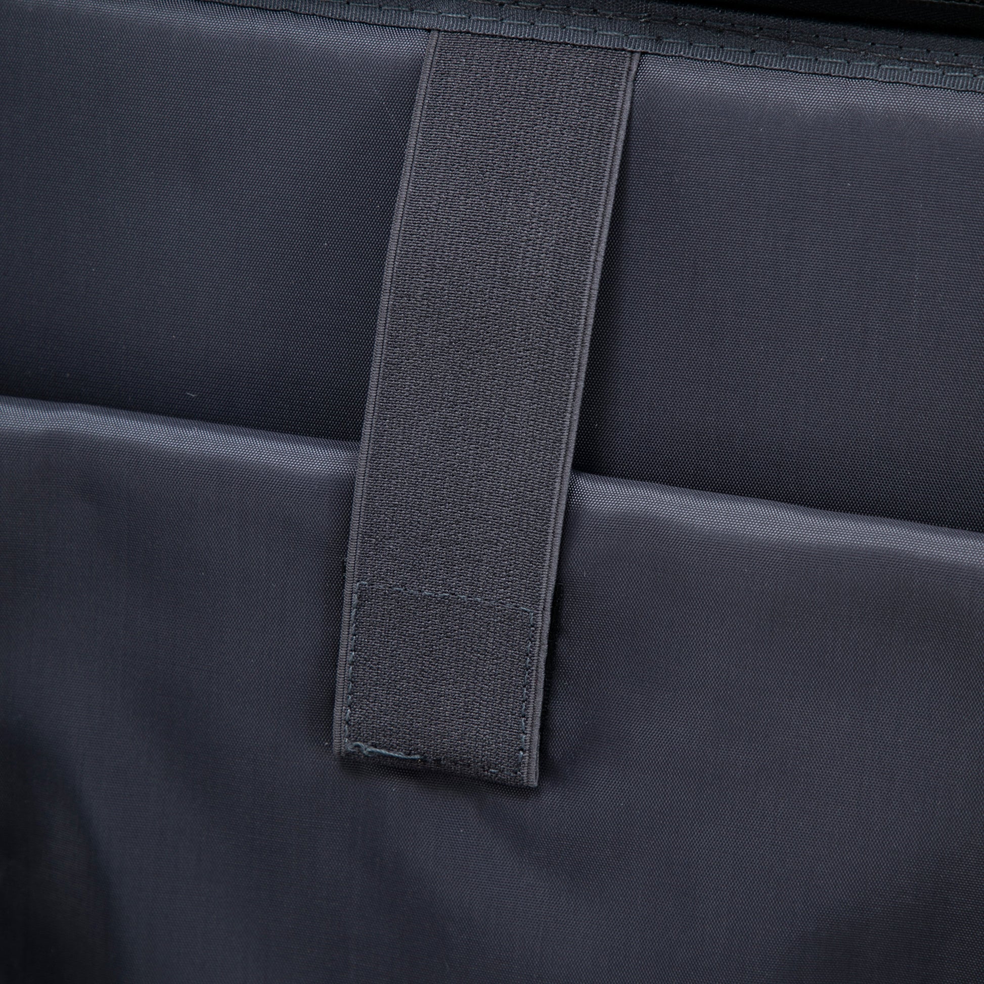 Luggage set strap closeup on dark fabric with HouseOfZazla branding (14' & 20' ABS Spinner Wheel) on Tampa Home & Garden Store