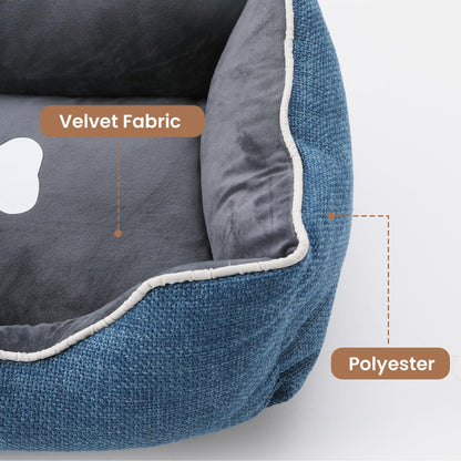 Small dog bed in blue velvet fabric with grey plush interior, white piping, anti-slip bottom on Tampa Home & Garden Store