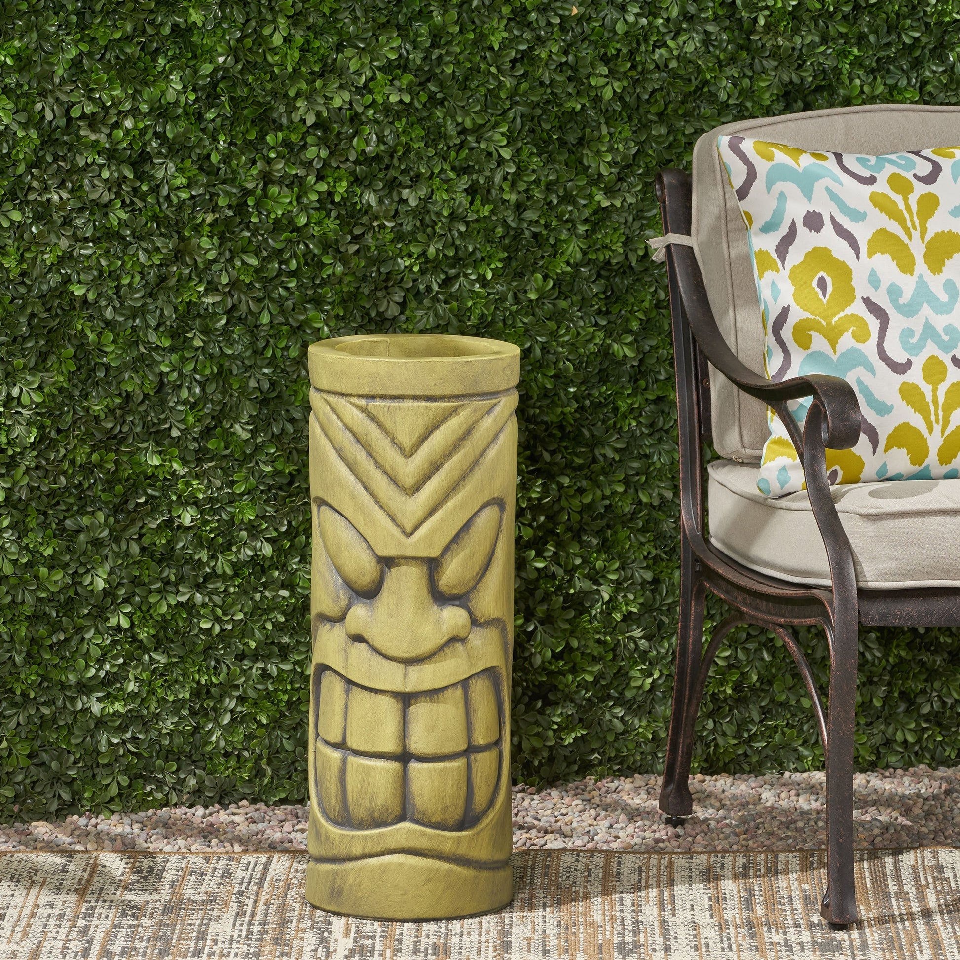 Stone statue urn planter in antique green finish with geometric carvings on Tampa Home & Garden Store
