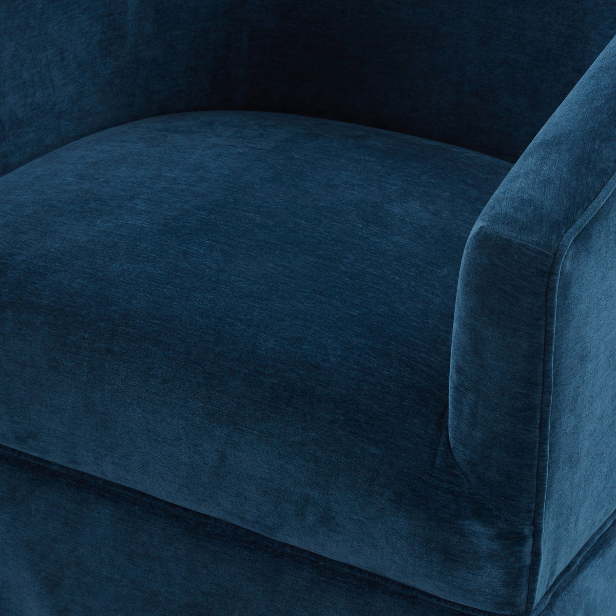 Skirted swivel chair upholstery in blue velvet with textured fabric close-up on Tampa Home & Garden Store