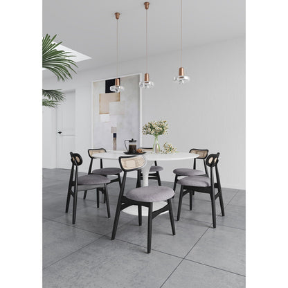 Dining chair set with cane backrests in black frames around a white round table on Tampa Home & Garden Store