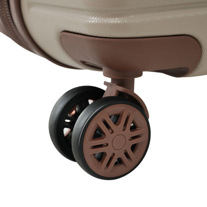 Luggage wheel assembly for brown hard-shell rolling suitcase with brown frame visible on Tampa Home & Garden Store