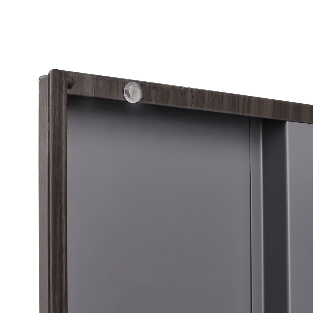 Metal storage cabinet top edge in dark wood grain with clear round bumper on Tampa Home & Garden Store