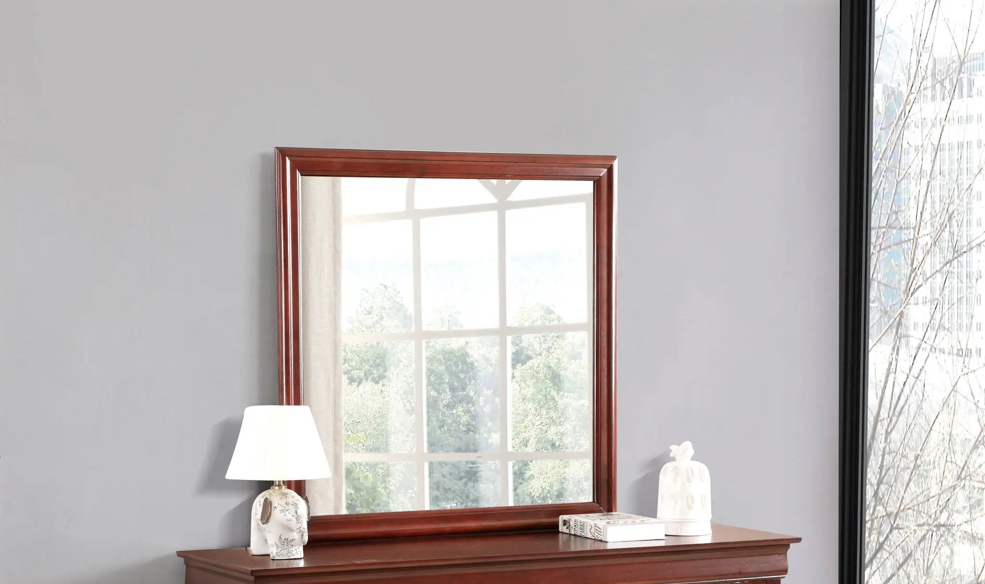 Traditional wall mirror with brown wood veneer frame above a wooden console table on Tampa Home & Garden Store