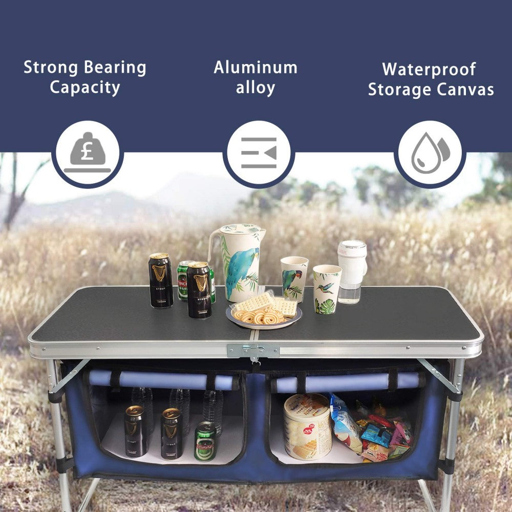Folding camping table and storage compartment