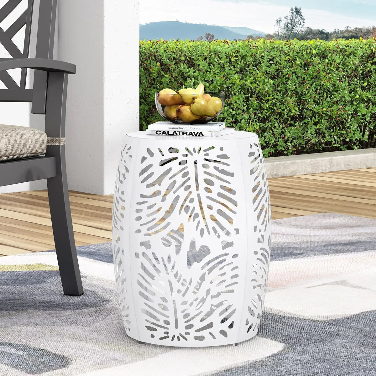 White metal outdoor end table with palm leaf cut-out pattern, round perforated body on Tampa Home & Garden Store