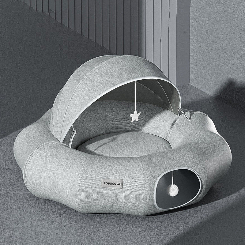 Round cat tunnel nest bed with partial cover in light gray plush, star toy, Popocola label on Tampa Home & Garden Store