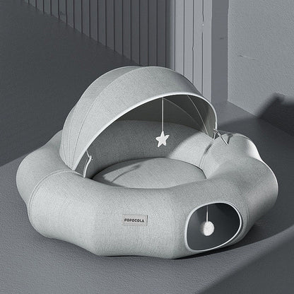 Round cat tunnel nest bed with partial cover in light gray plush, star toy, Popocola label on Tampa Home & Garden Store