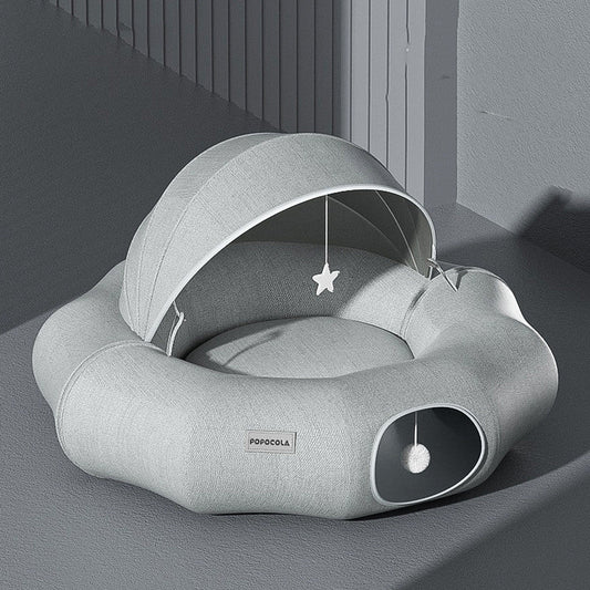 Round cat tunnel nest bed with partial cover in light gray plush, star toy, Popocola label on Tampa Home & Garden Store