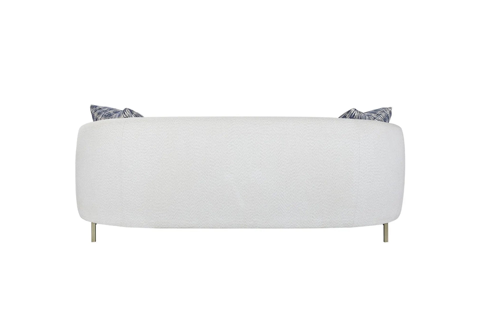Rounded white stationary sofa with textured fabric and two blue patterned cushions, brass legs on Tampa Home & Garden Store