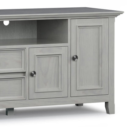 Wide solid wood TV stand in gray-washed finish with open shelf and two paneled doors on Tampa Home & Garden Store