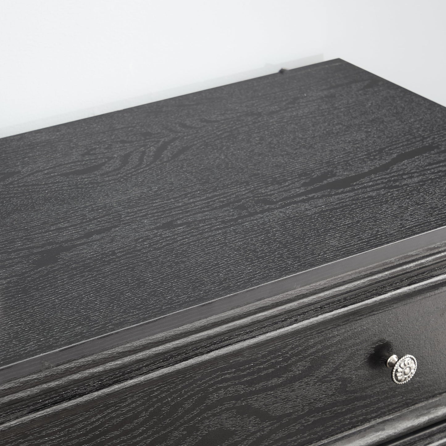Modern 5-drawer black dresser with ornate silver knob for living room storage on Tampa Home & Garden Store