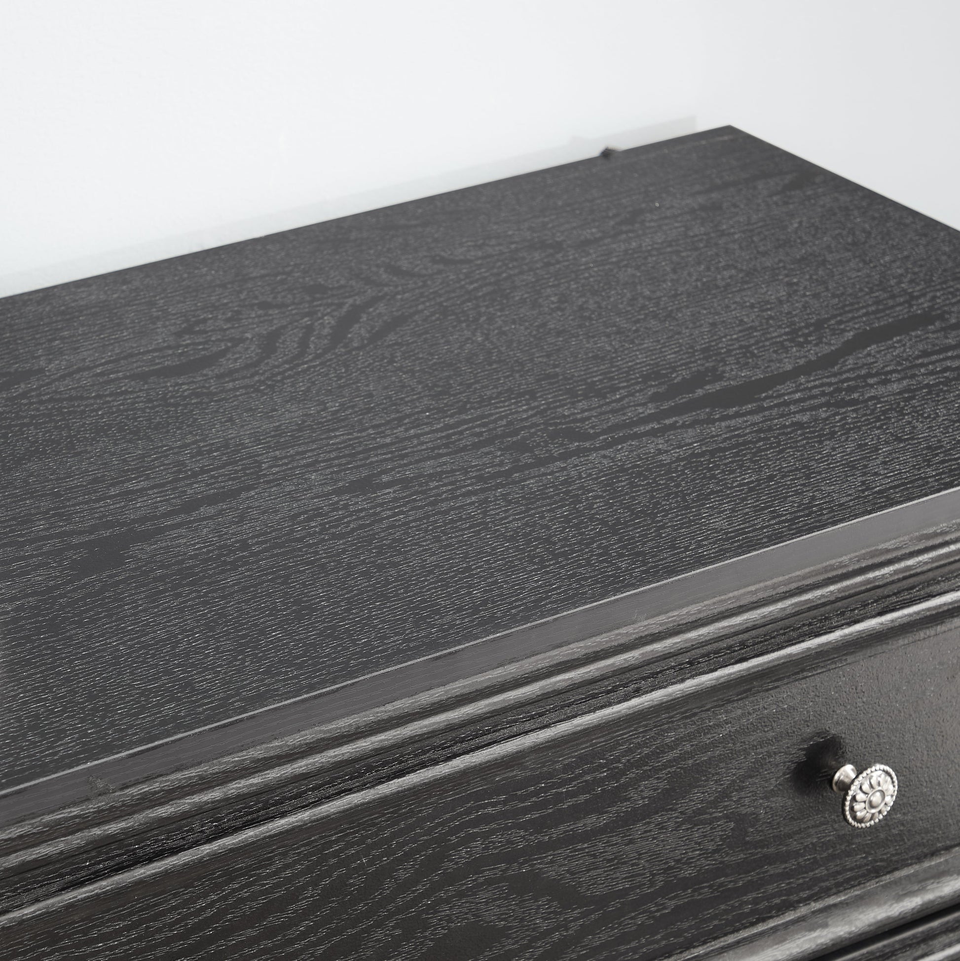 Modern 5-drawer black dresser with ornate silver knob for living room storage on Tampa Home & Garden Store