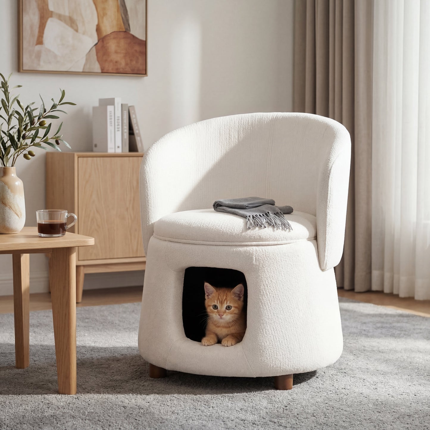 Beige plush upholstery chair with hidden pet nook, cat peeking from the opening on Tampa Home & Garden Store