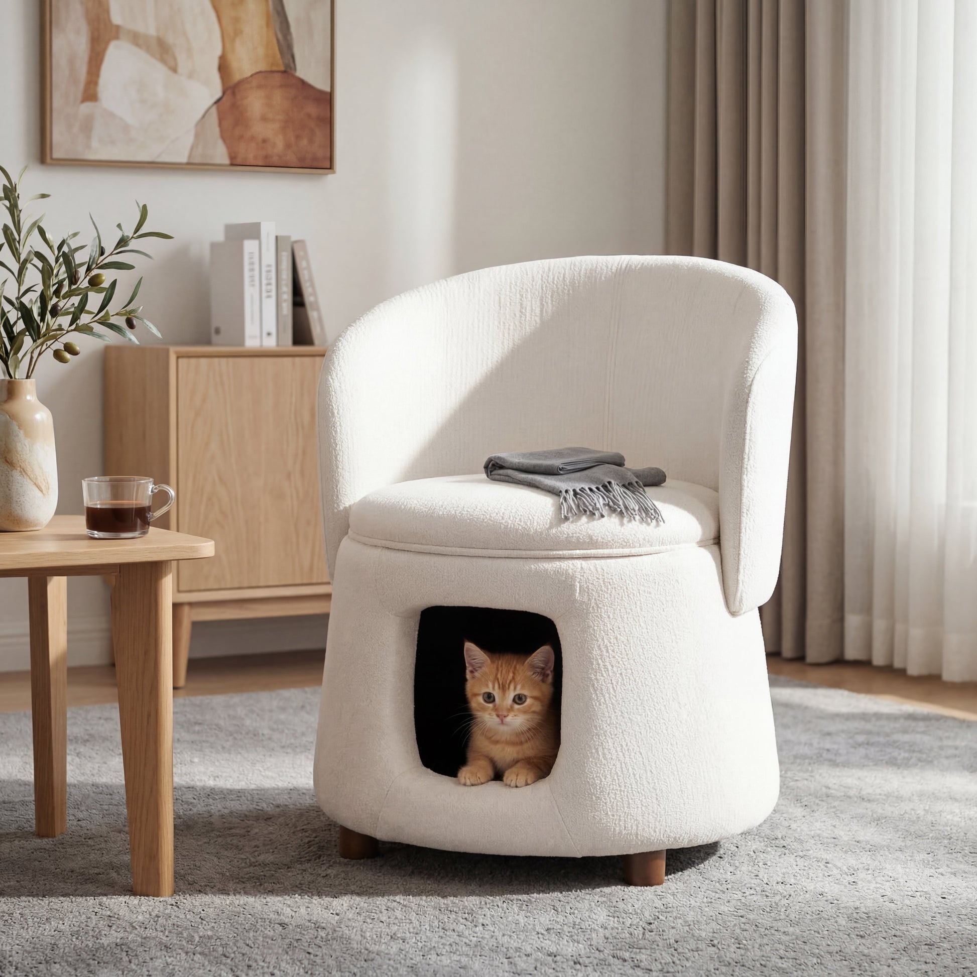 Beige plush upholstery chair with hidden pet nook, cat peeking from the opening on Tampa Home & Garden Store