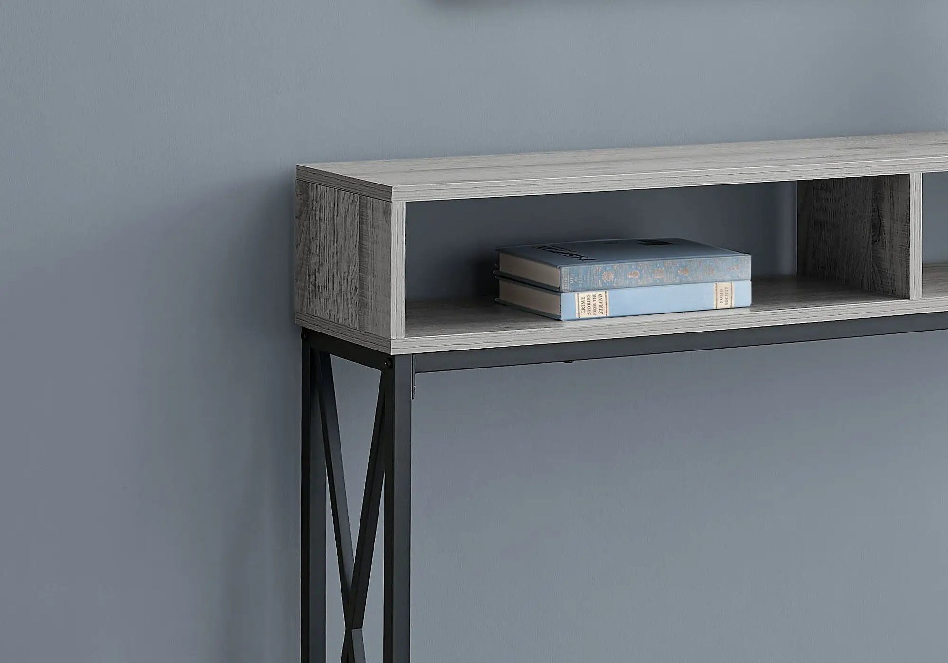 Accent console table for entryway in gray wood with black metal legs; shelf with blue books on Tampa Home & Garden Store