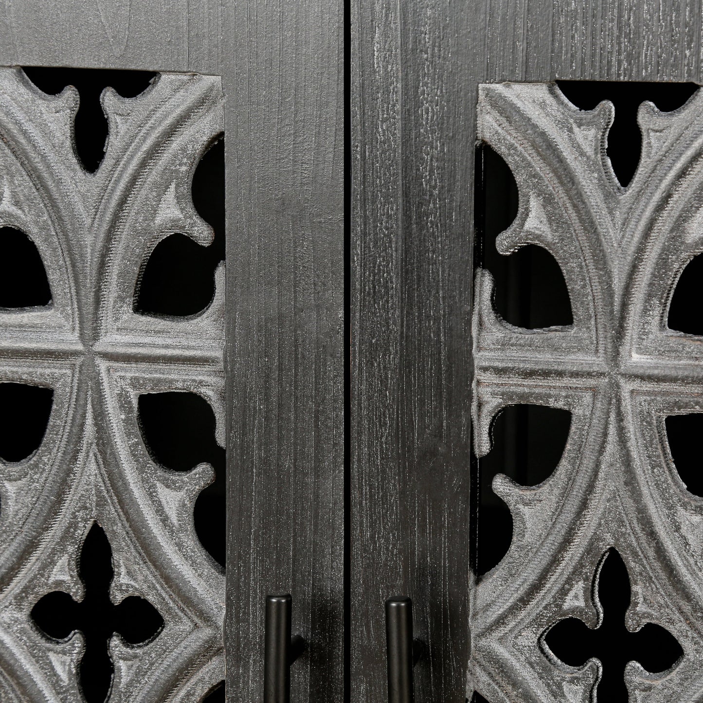 Hollow four-door antique cabinet front with dark wood panels and ornate gray metal fretwork on Tampa Home & Garden Store
