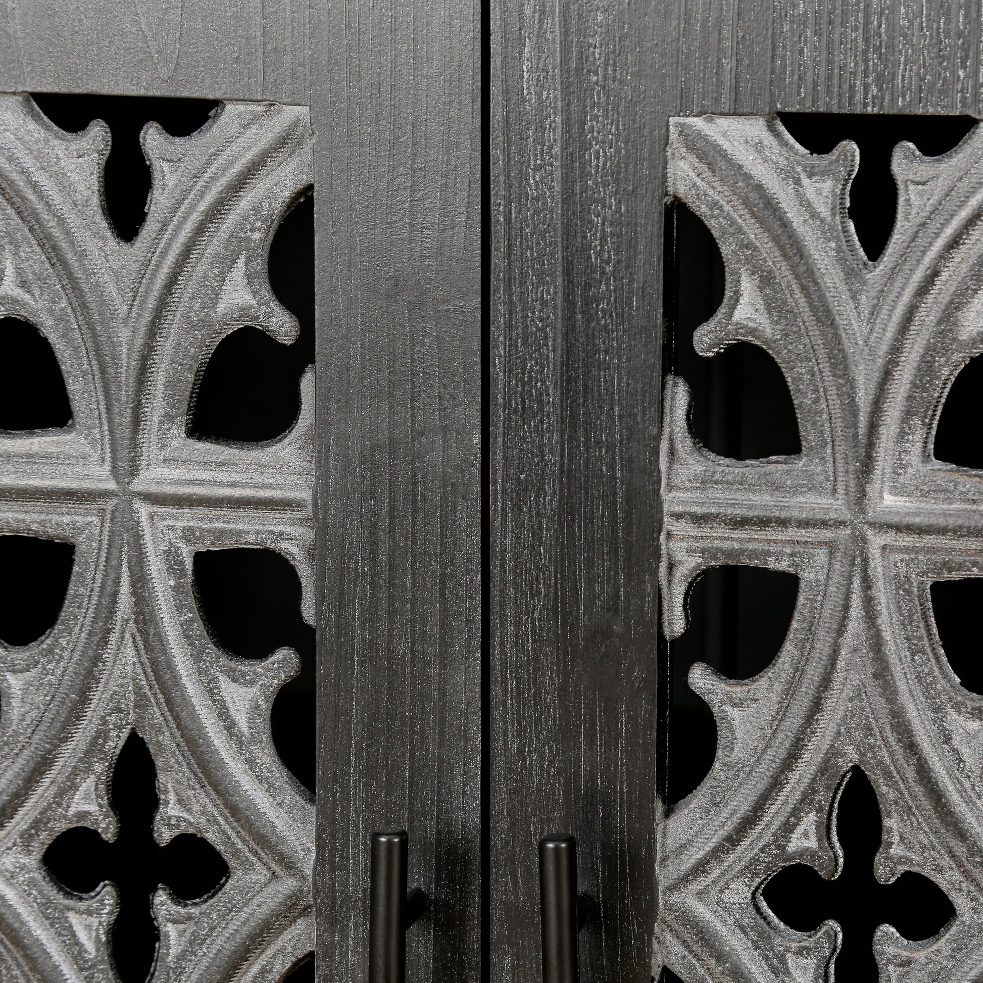 Hollow four-door antique cabinet front with dark wood panels and ornate gray metal fretwork on Tampa Home & Garden Store
