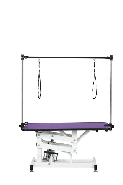 Hydraulic pet grooming table with H-arm, purple non-slip surface, white frame on Tampa Home & Garden Store