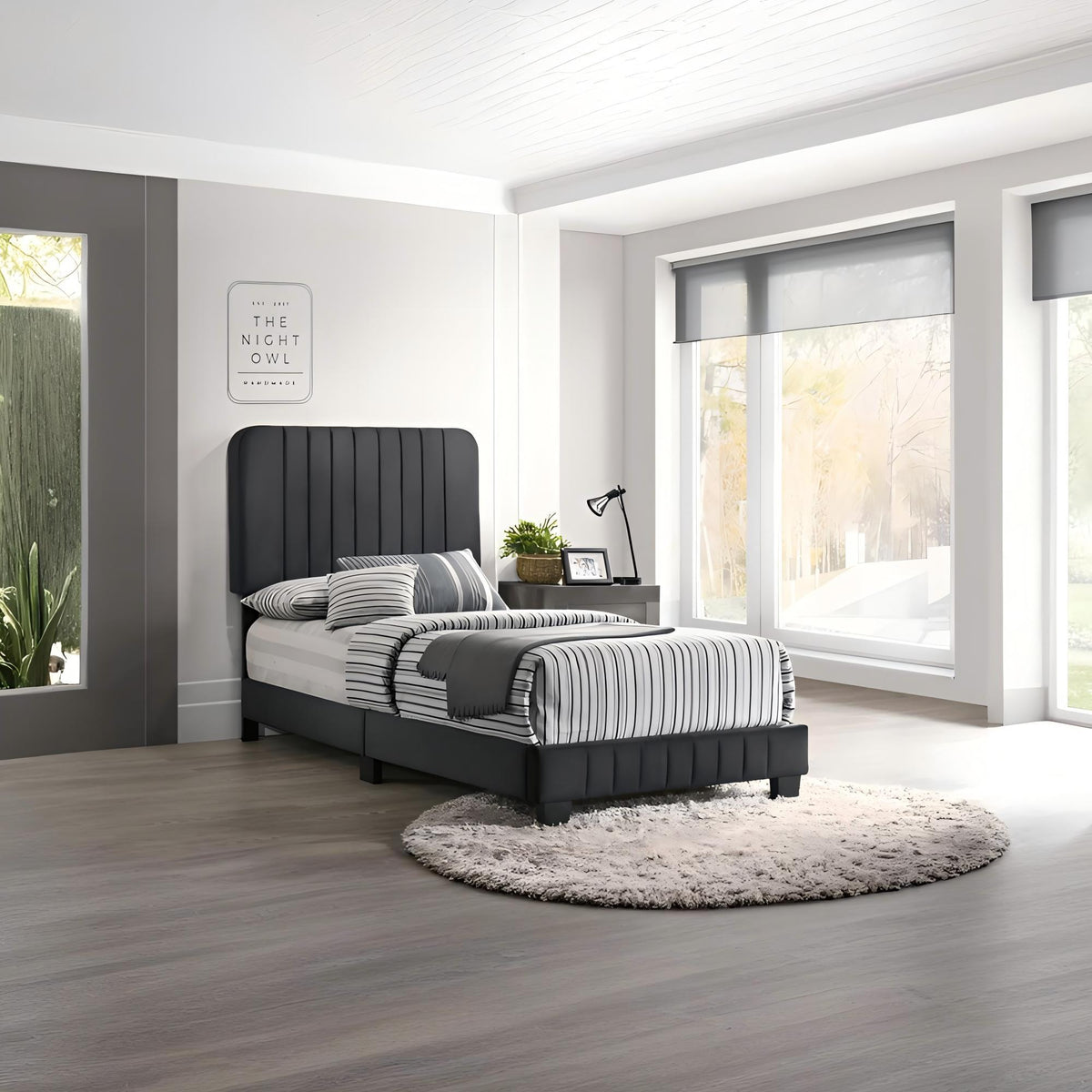 Channel Tufted Bed with tall charcoal headboard and striped bedding in a bright modern bedroom on Tampa Home & Garden Store