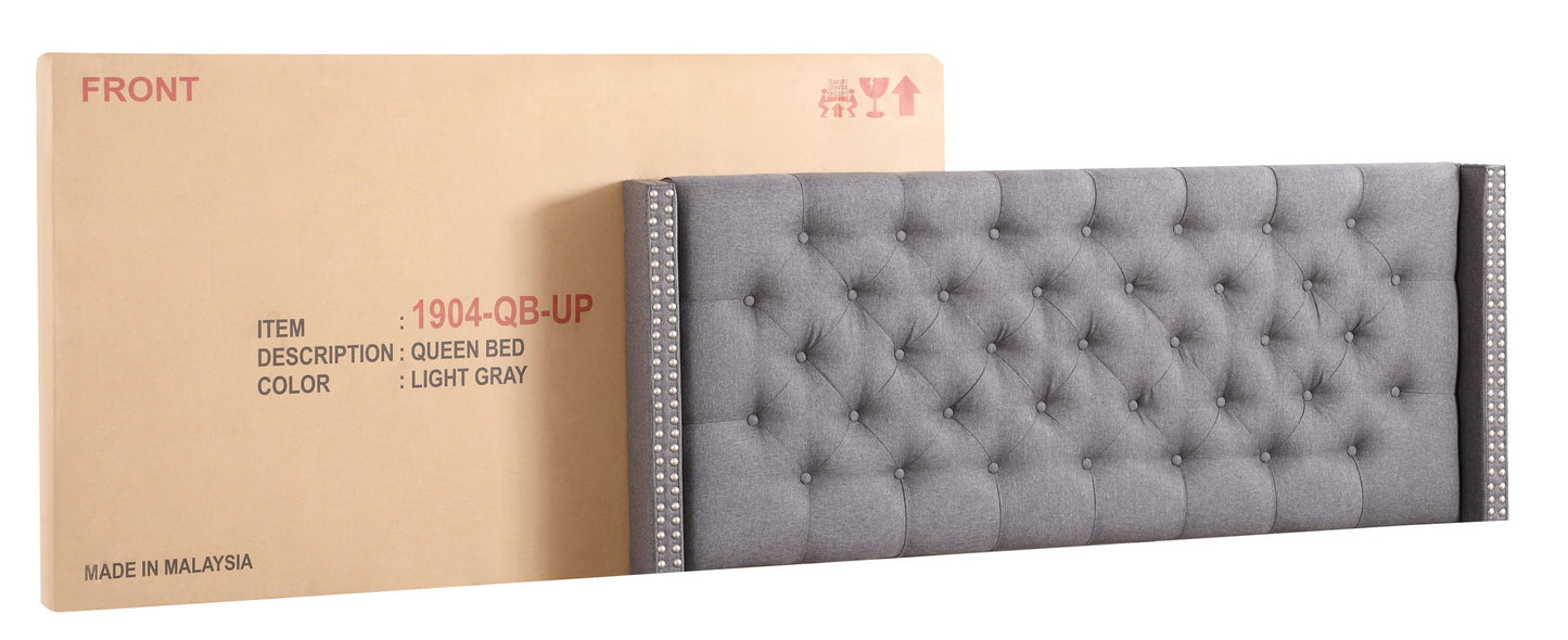 Nailhead upholstered queen bed in light gray tufted fabric with nailhead trim on sides on Tampa Home & Garden Store