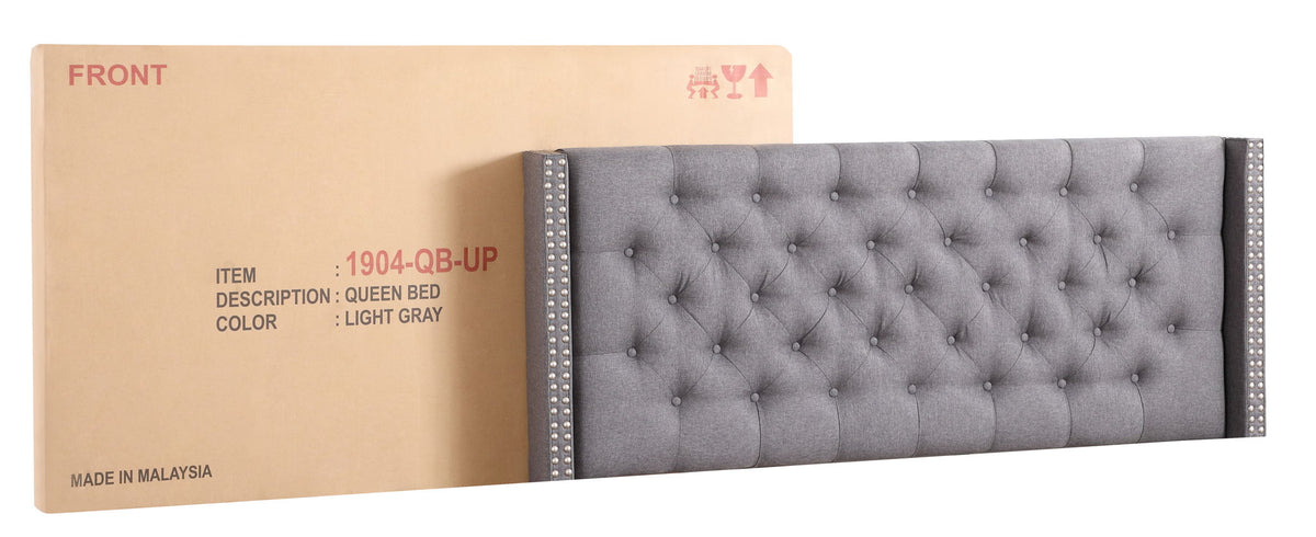 Nailhead upholstered queen bed in light gray tufted fabric with nailhead trim on sides on Tampa Home & Garden Store