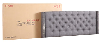 Nailhead upholstered queen bed in light gray tufted fabric with nailhead trim on sides on Tampa Home & Garden Store