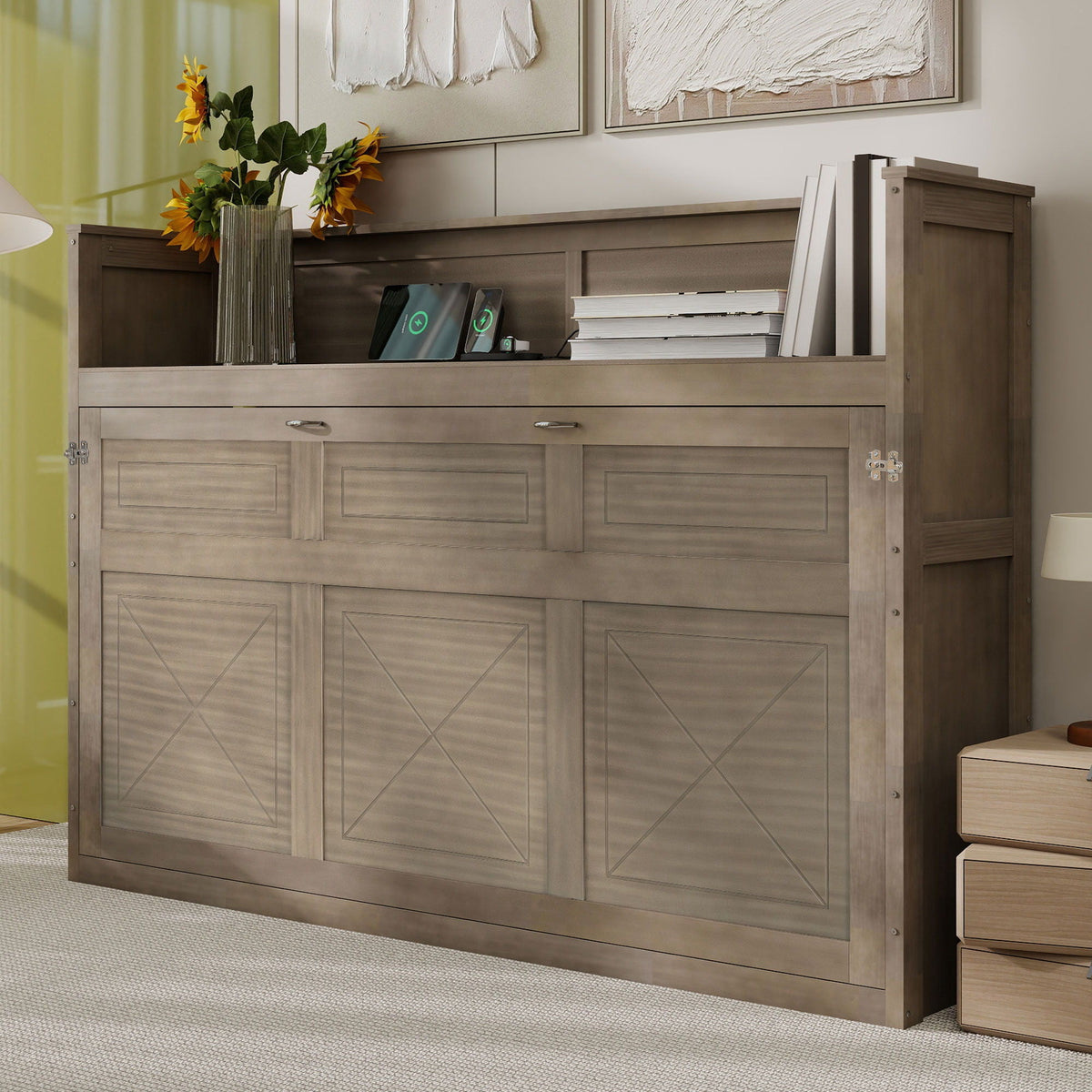 Murphy bed with desk in gray wood finish with stack of books and vase of sunflowers on top on Tampa Home & Garden Store