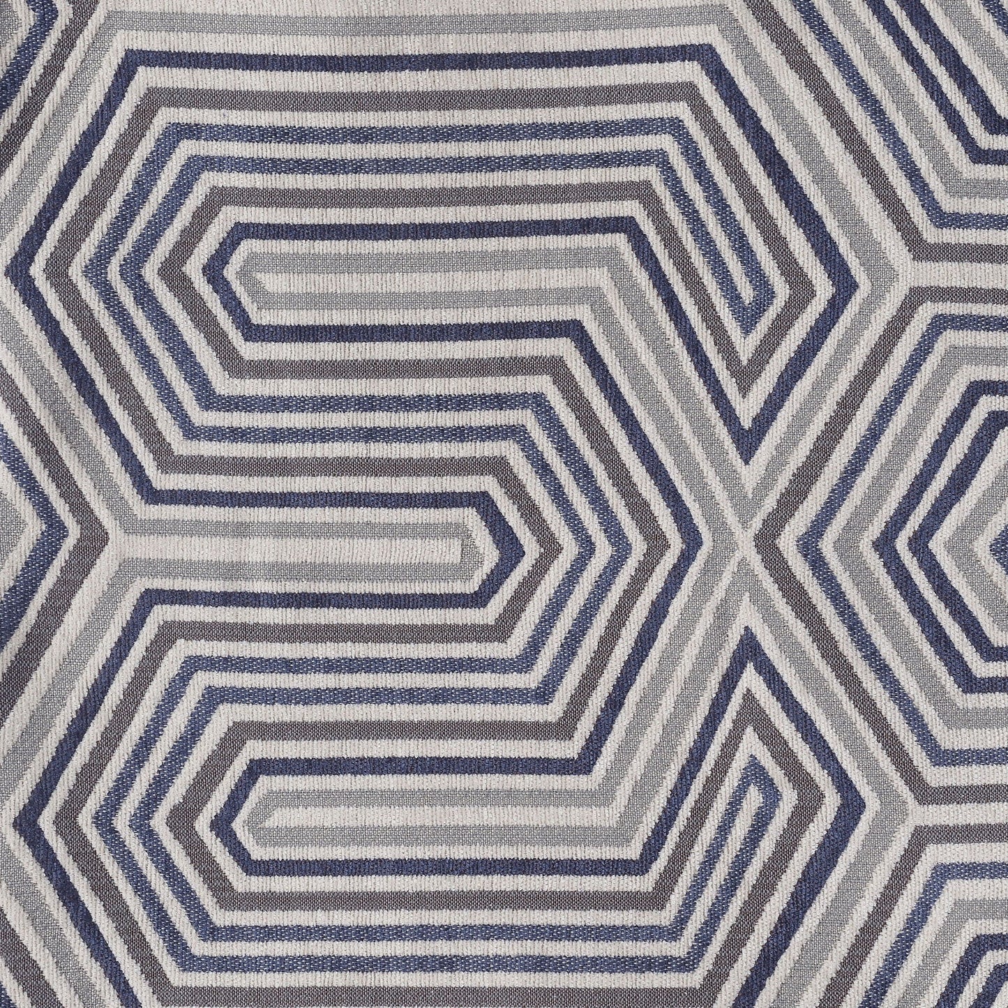 Area rug with blue gray concentric hexagonal geometric pattern and textured weave on Tampa Home & Garden Store