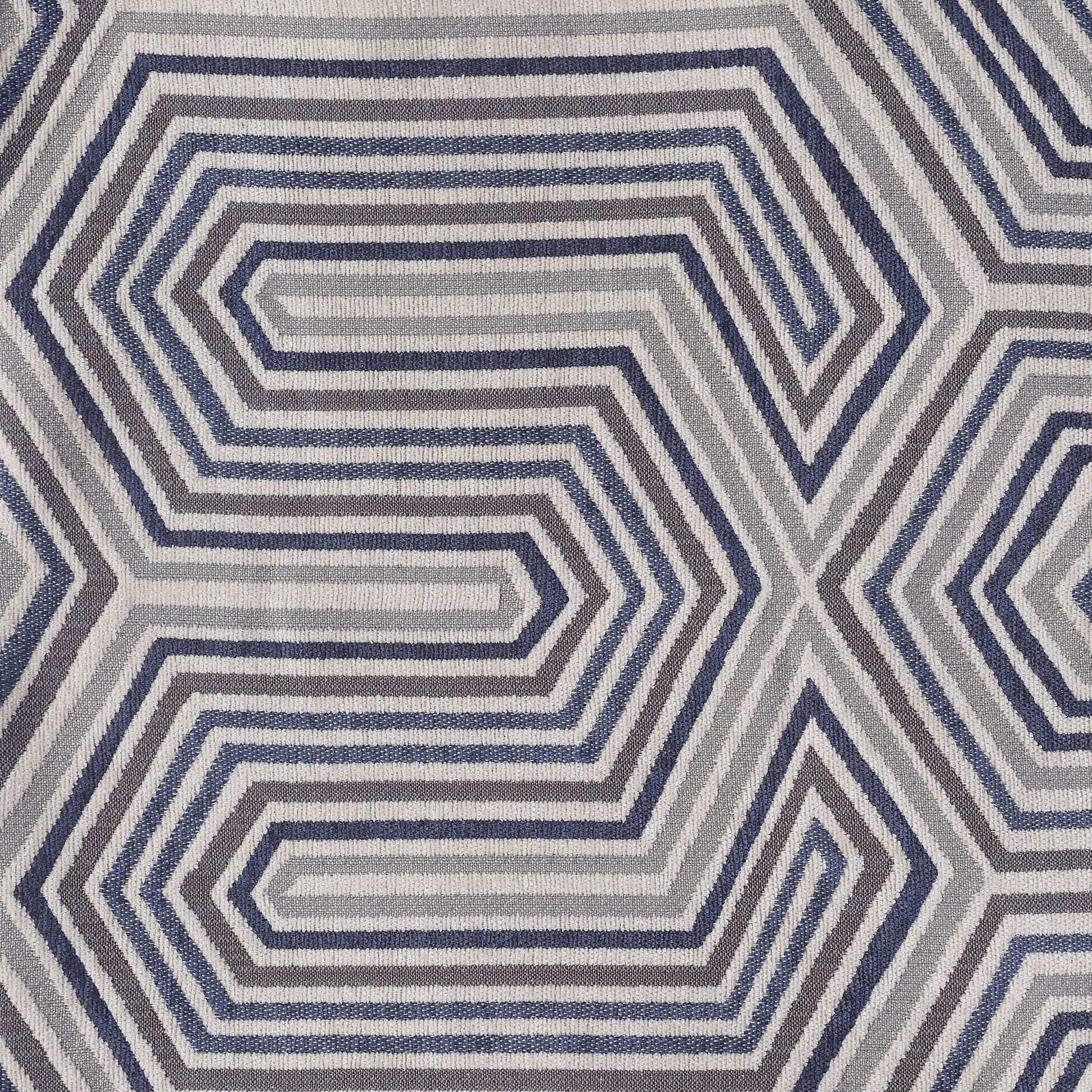 Area rug with blue gray concentric hexagonal geometric pattern and textured weave on Tampa Home & Garden Store