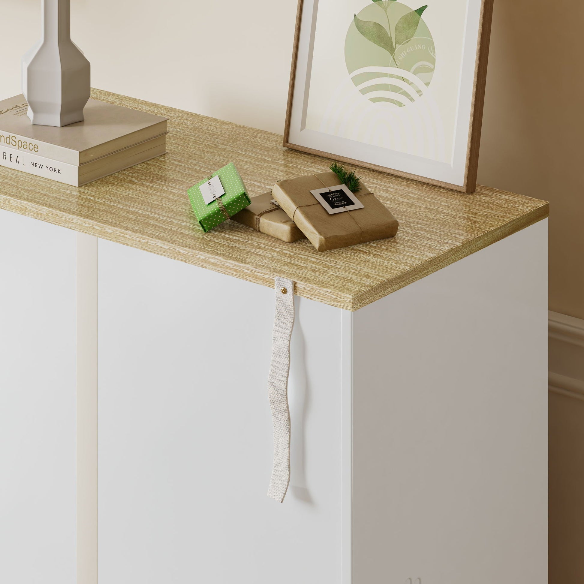Cat Litter Box Enclosure by HouseOfZazla on a white and light brown wooden desk with framed leaf art and gift boxes on Tampa Home & Garden Store