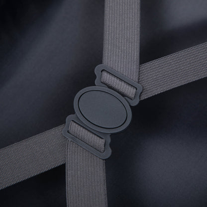 Luggage strap close-up in gray webbing with black buckle on dark fabric on Tampa Home & Garden Store