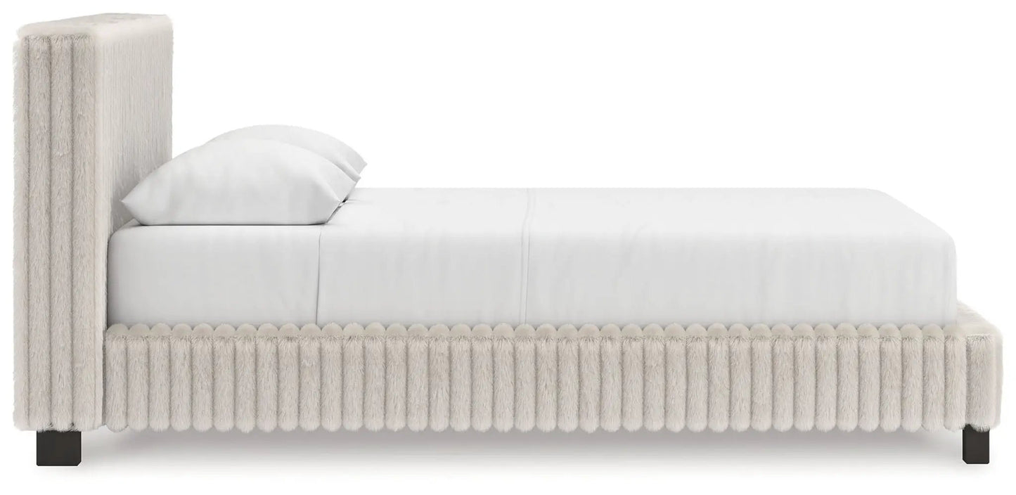 Zuraleus upholstered bed cream boucle with tall headboard and pom-pom fringe base on Tampa Home & Garden Store