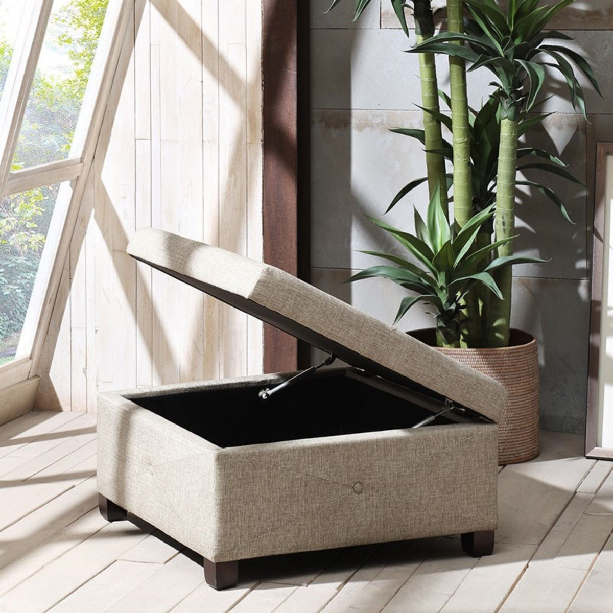 Aspen Storage Ottoman with soft-close lid in light brown upholstery lid open reveals dark interior on Tampa Home & Garden Store