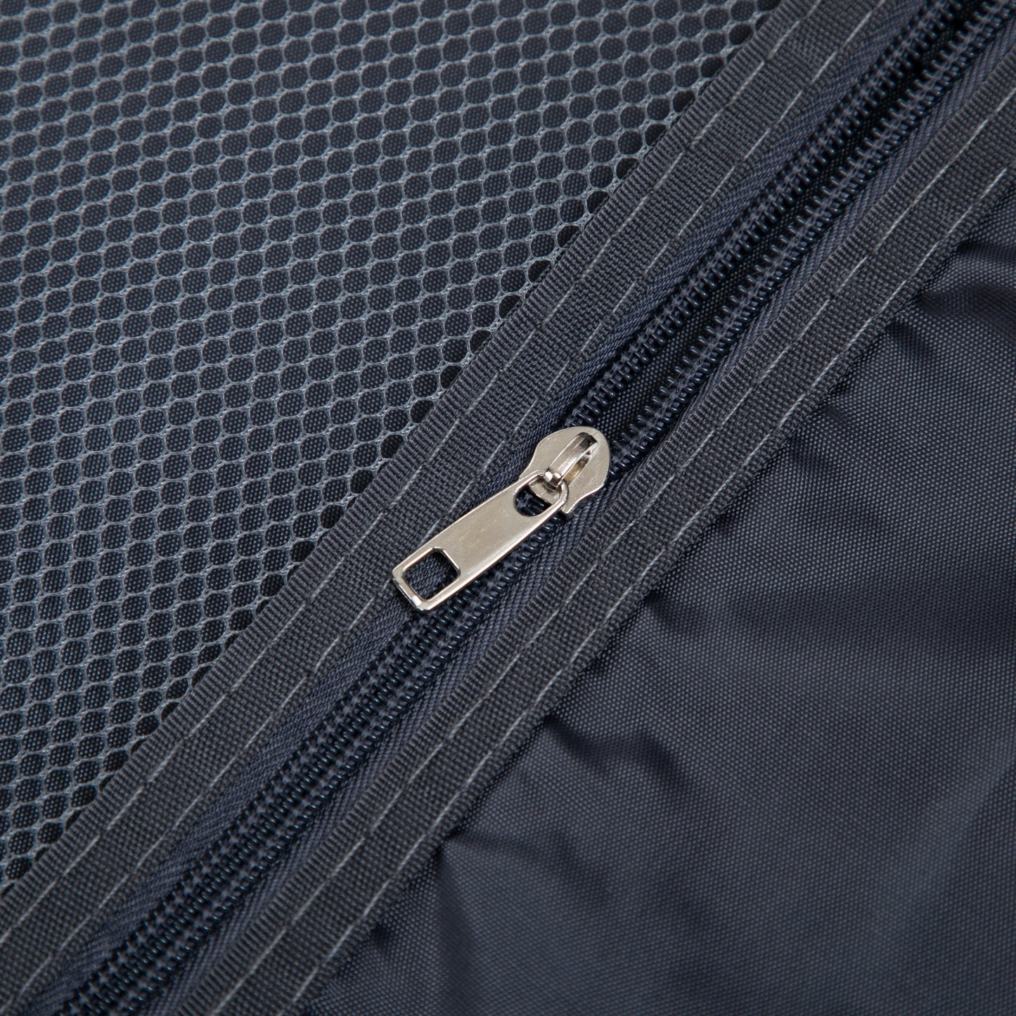 Luggage bag dark blue fabric close-up with metal zipper and honeycomb texture on Tampa Home & Garden Store