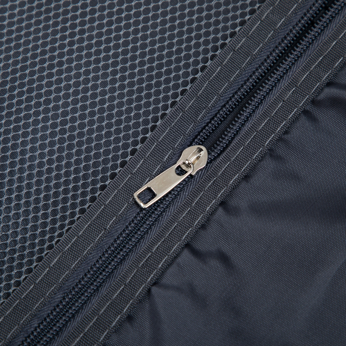 Luggage bag dark blue fabric close-up with metal zipper and honeycomb texture on Tampa Home & Garden Store