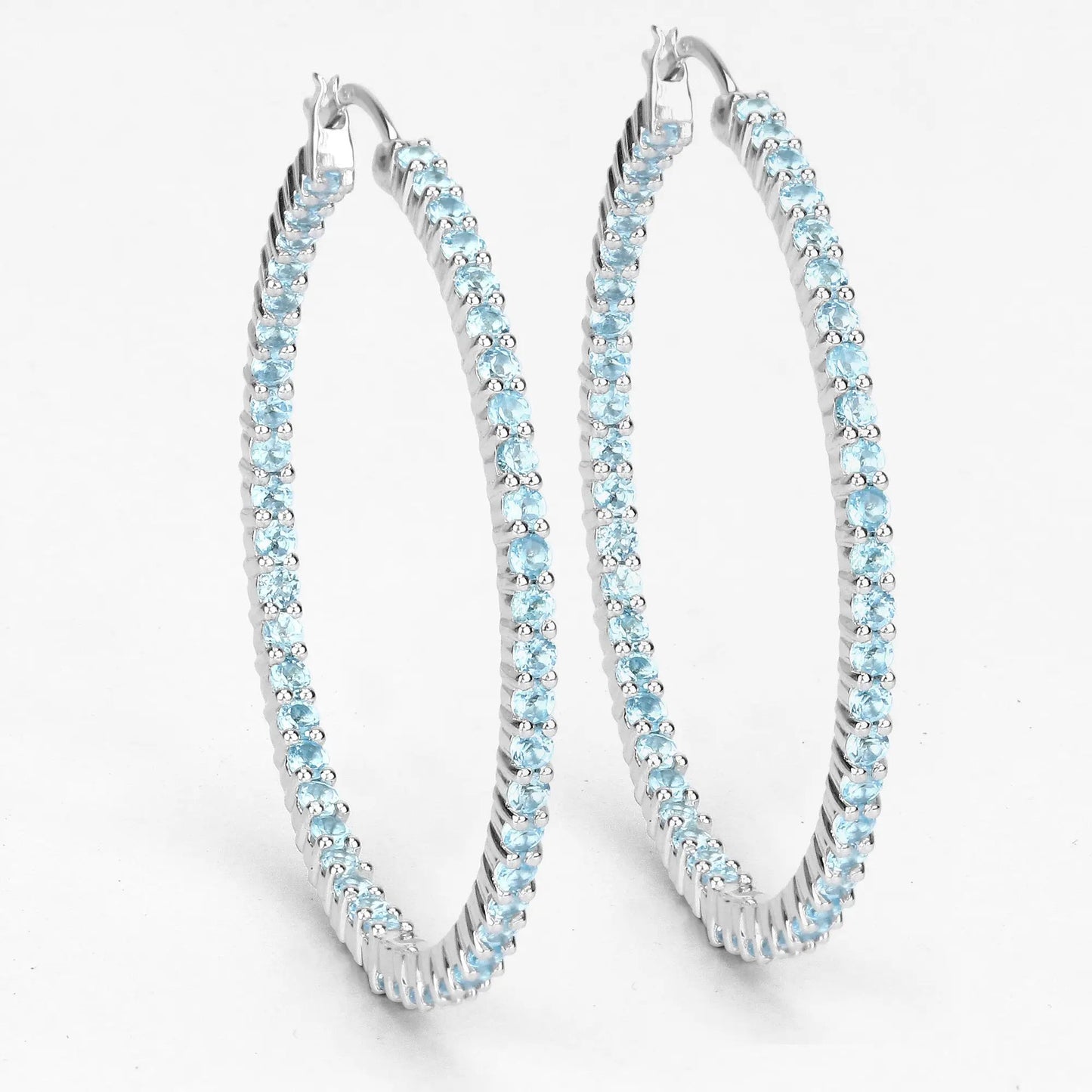 Three sterling silver hoop earrings set with genuine Swiss blue topaz stones on Tampa Home & Garden Store