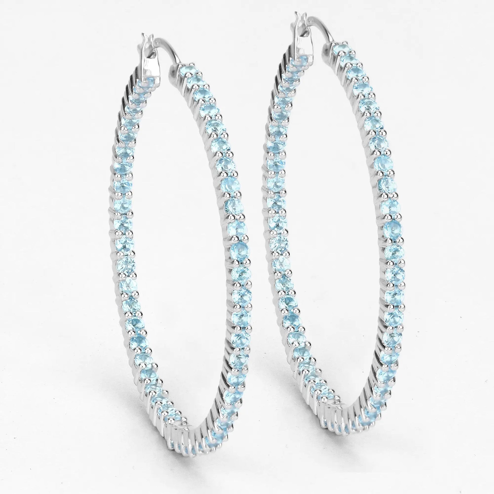 Three sterling silver hoop earrings set with genuine Swiss blue topaz stones on Tampa Home & Garden Store