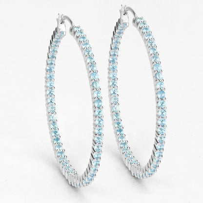 Three sterling silver hoop earrings set with genuine Swiss blue topaz stones on Tampa Home & Garden Store
