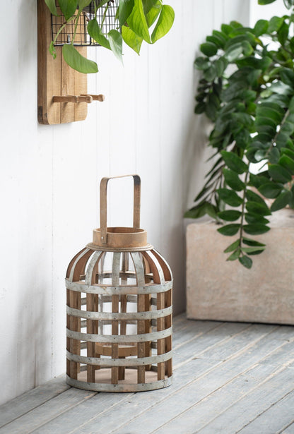 Decorative wooden lantern with handle by HouseOfZazla, rustic brown finish and metal bands on Tampa Home & Garden Store