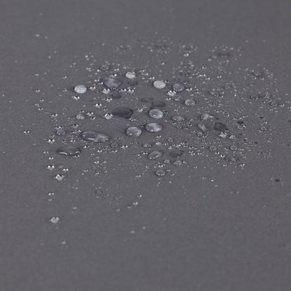 Outdoor chaise lounge fabric close-up in gray with scattered water droplets on surface on Tampa Home & Garden Store