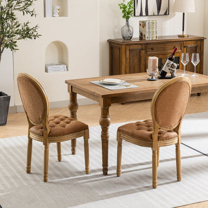 Pair of French style solid wood dining chairs with nailhead trim in tan upholstery on Tampa Home & Garden Store