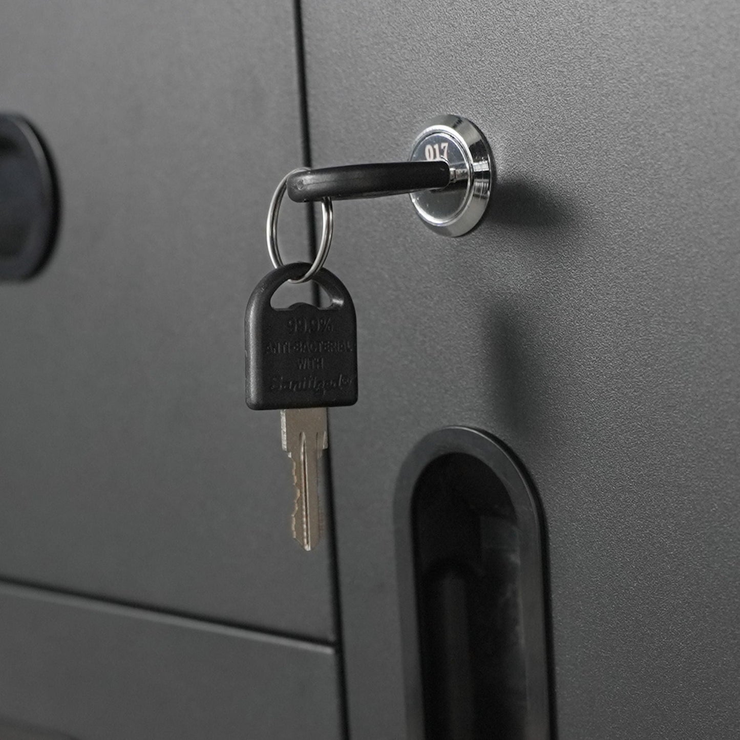 Sturdy metal tool storage cabinet with key lock and black key fob on Tampa Home & Garden Store