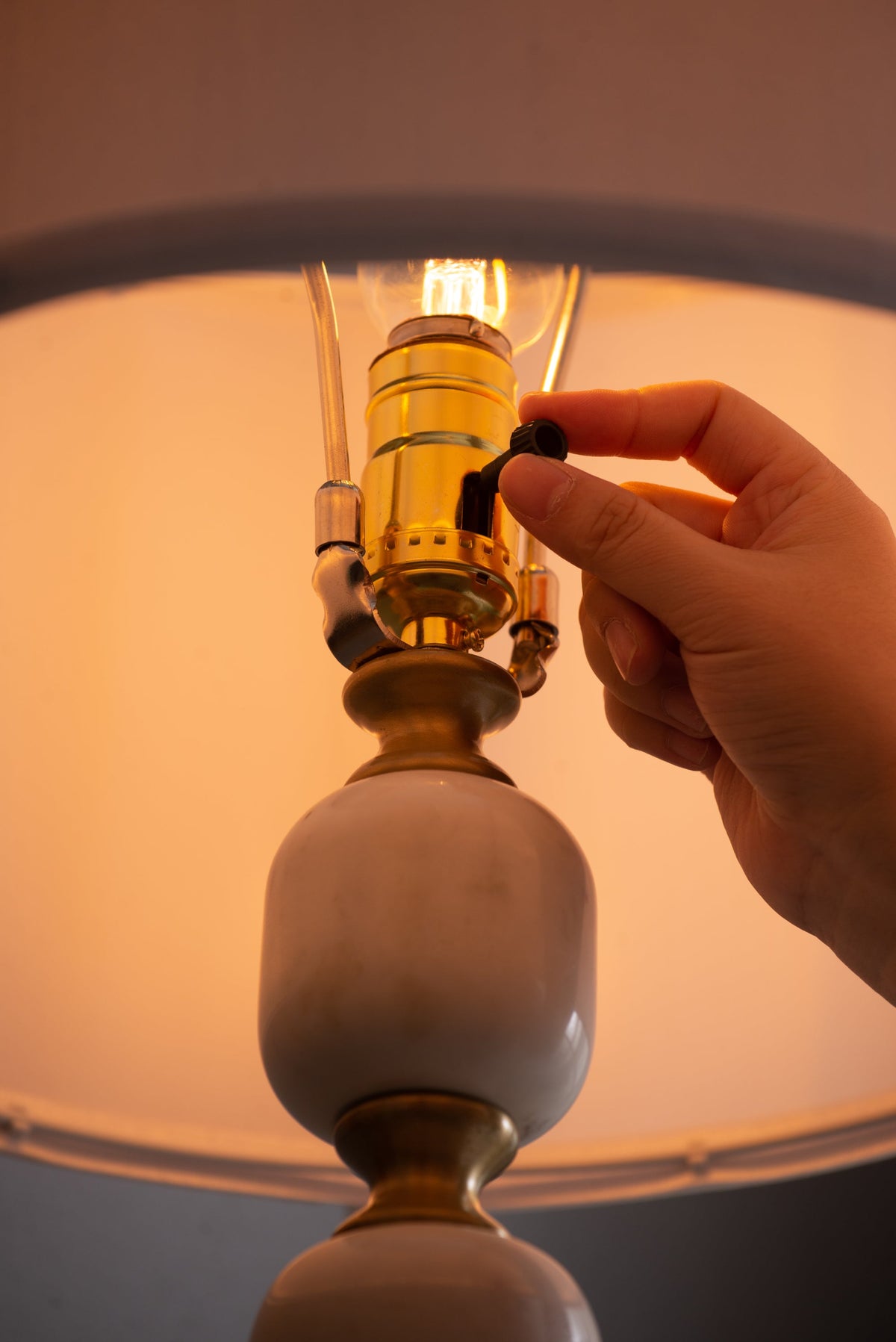 D15x26.5 Table Lamp brass hardware, white ceramic globe, warm amber glow on Tampa Home & Garden Store