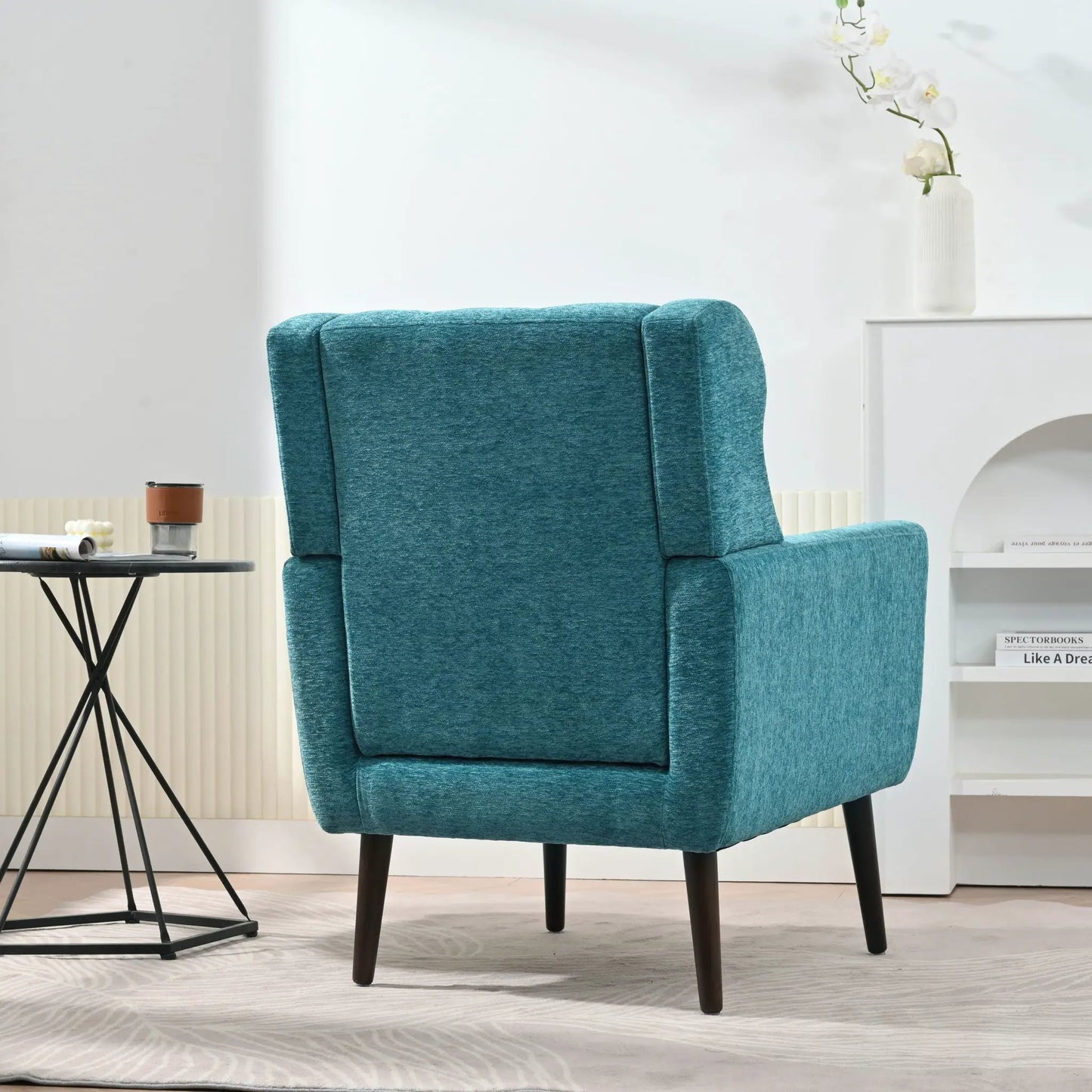 Teal fabric upholstered accent chair with dark wood legs from Unique Piece in living room on Tampa Home & Garden Store
